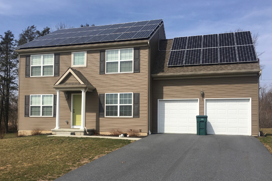 solar panels on home with brown siding average efficiency of solar panels