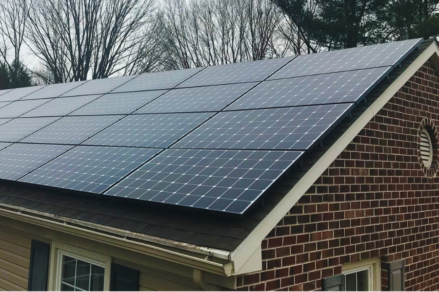 solar panels on home on a cloudy day