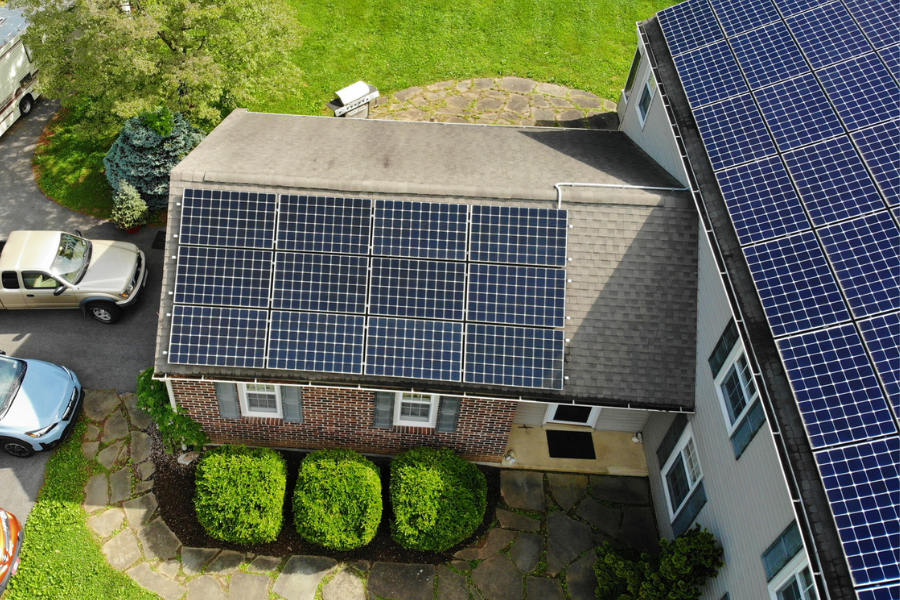 aerial view of solar panels on home with battery backup