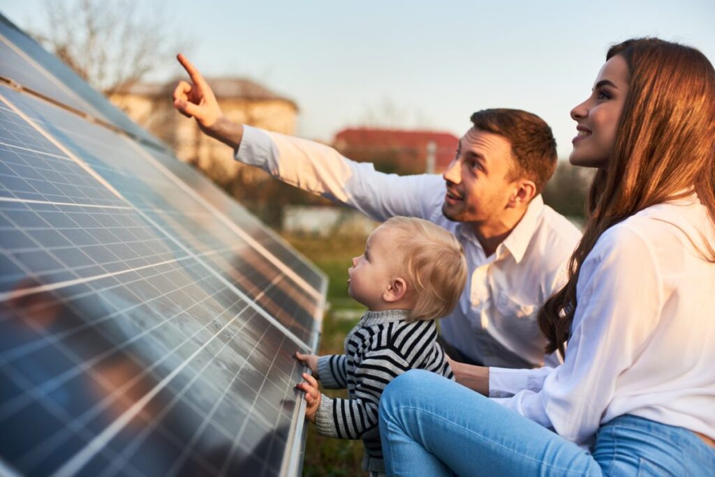 family showing their son ground mount solar panels