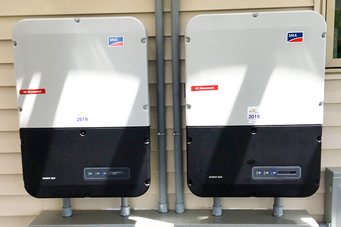 home battery backup on white siding of home