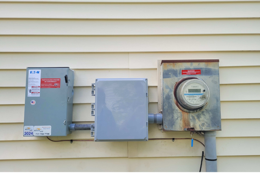 solar boxes on side of home