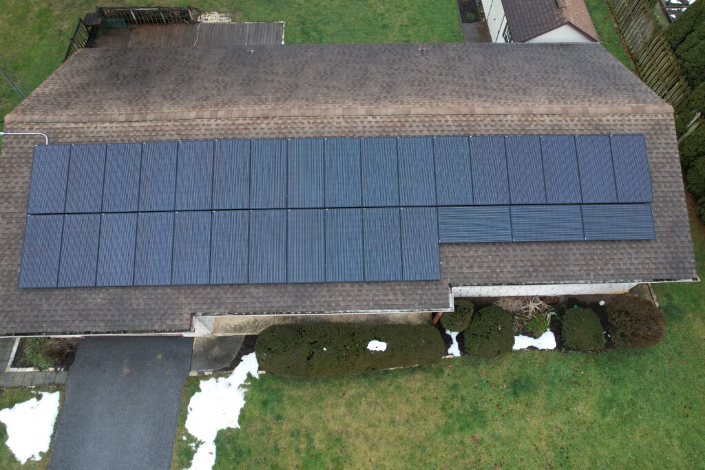 Close up drone shot of installed solar panels on a house roof in Brownstown, PA