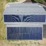 Drone image of 13.53kW solar panels on garage in Bernville, PA