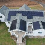 Drone image of house with multiple solar panels installed in New Providence, PA