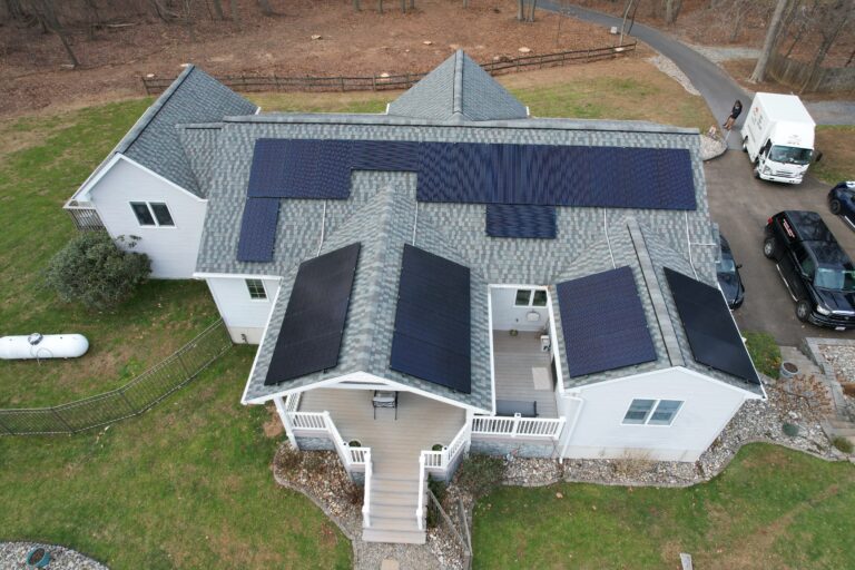 Drone image of house with multiple solar panels installed in New Providence, PA