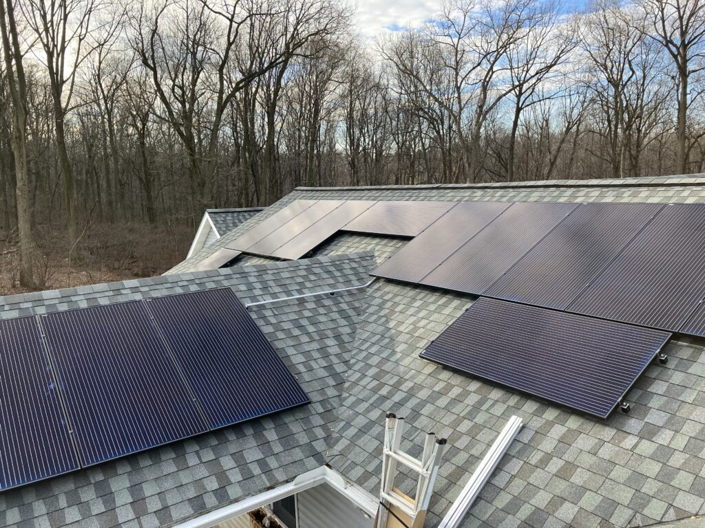 Grid-tied solar panels installed on Tough Track mounting system on house roof in New Providence, PA