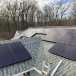 Grid-tied solar panels installed on Tough Track mounting system on house roof in New Providence, PA