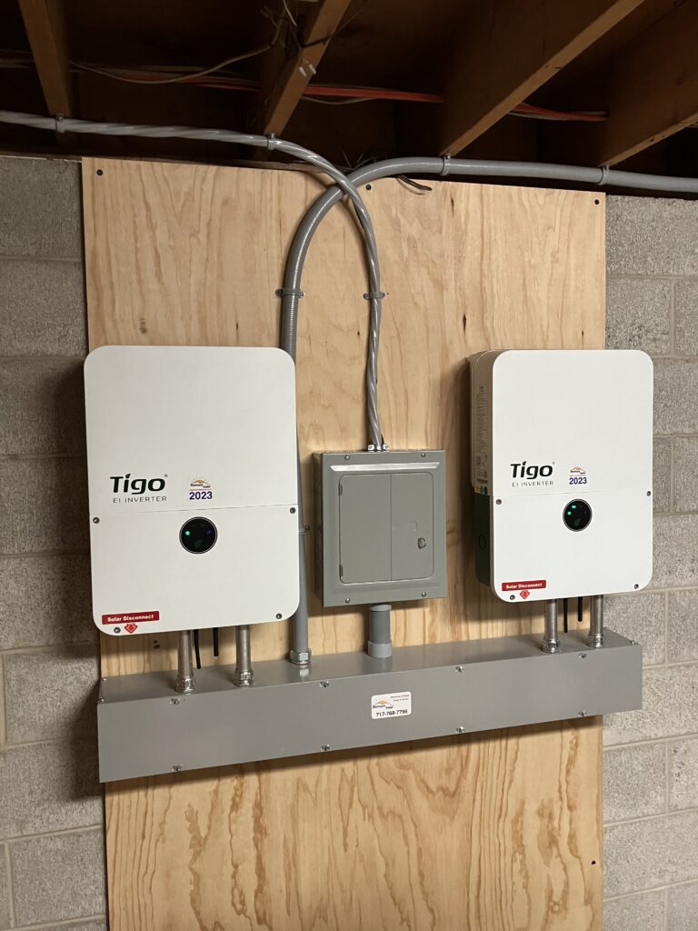 Two Tigo inverters mounted to wall of basement in Telford, PA