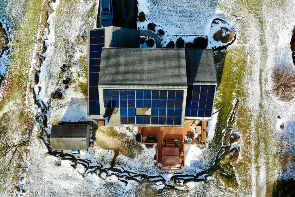 solar panels installed on the roof of a home surrounded by snow completed by a solar installer in downingtown pa
