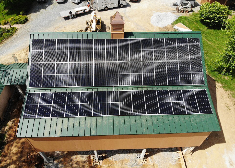 solar panels installed on a green metal roof by a solar installer in cleona pa