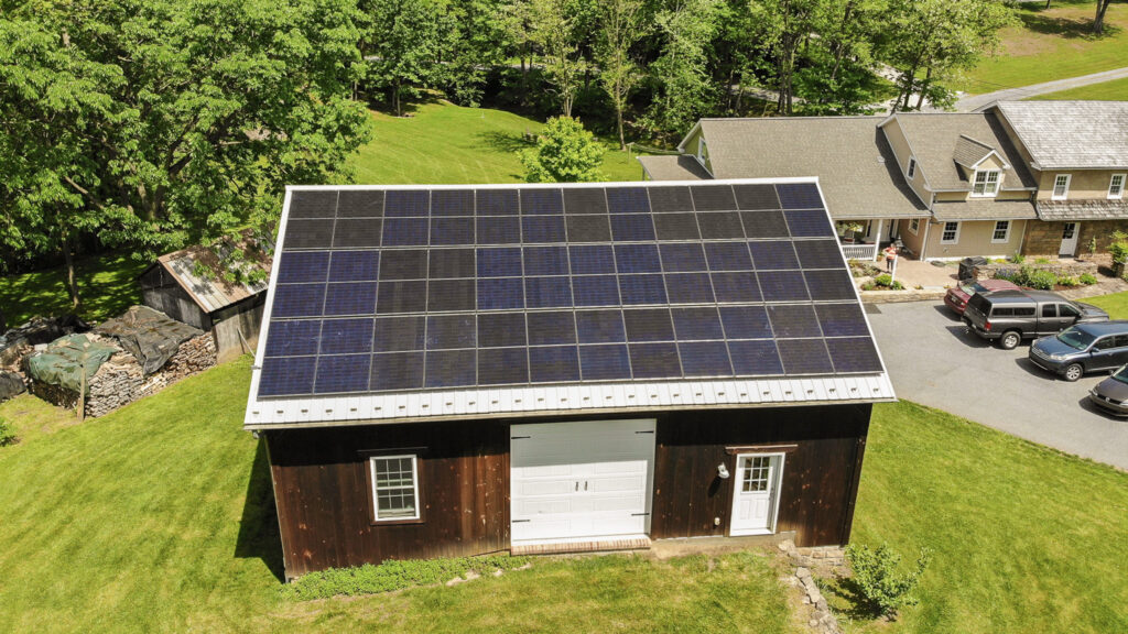 solar panels on top of a brown garage installed by a solar installer in fredericksburg pa