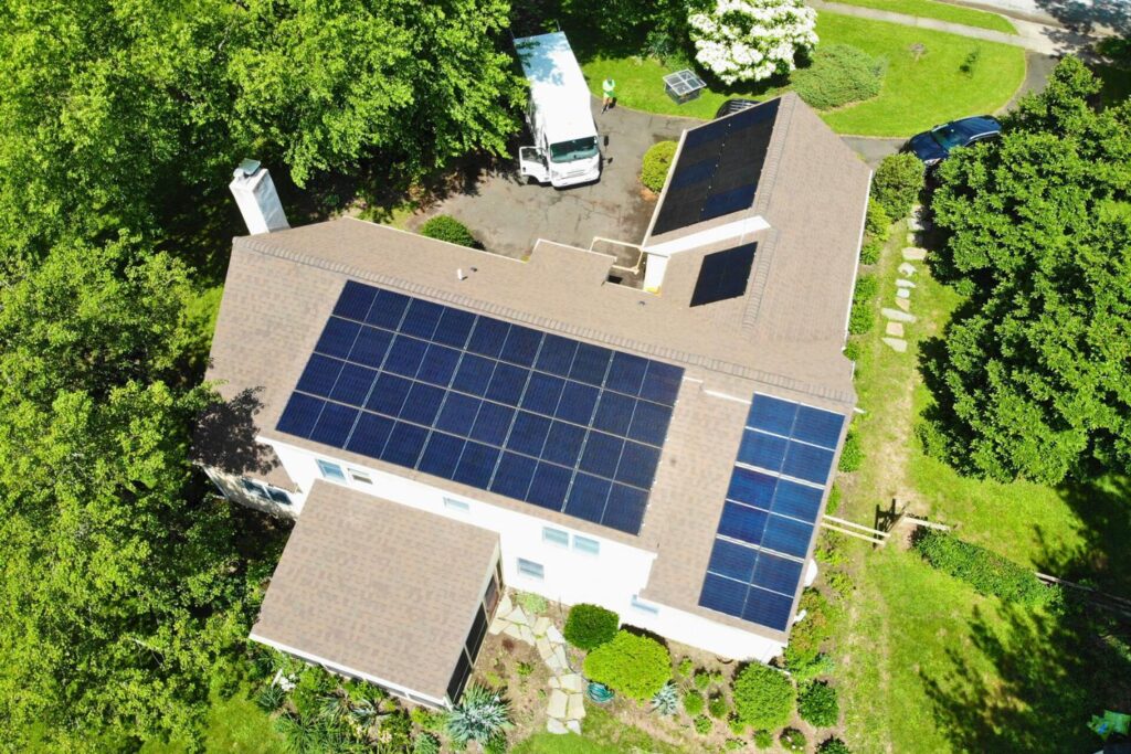 Belmont Solar Featured in This Old House Article about Solar Rebates with aerial view of solar panels on home