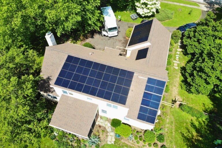 Belmont Solar Featured in This Old House Article about Solar Rebates with aerial view of solar panels on home