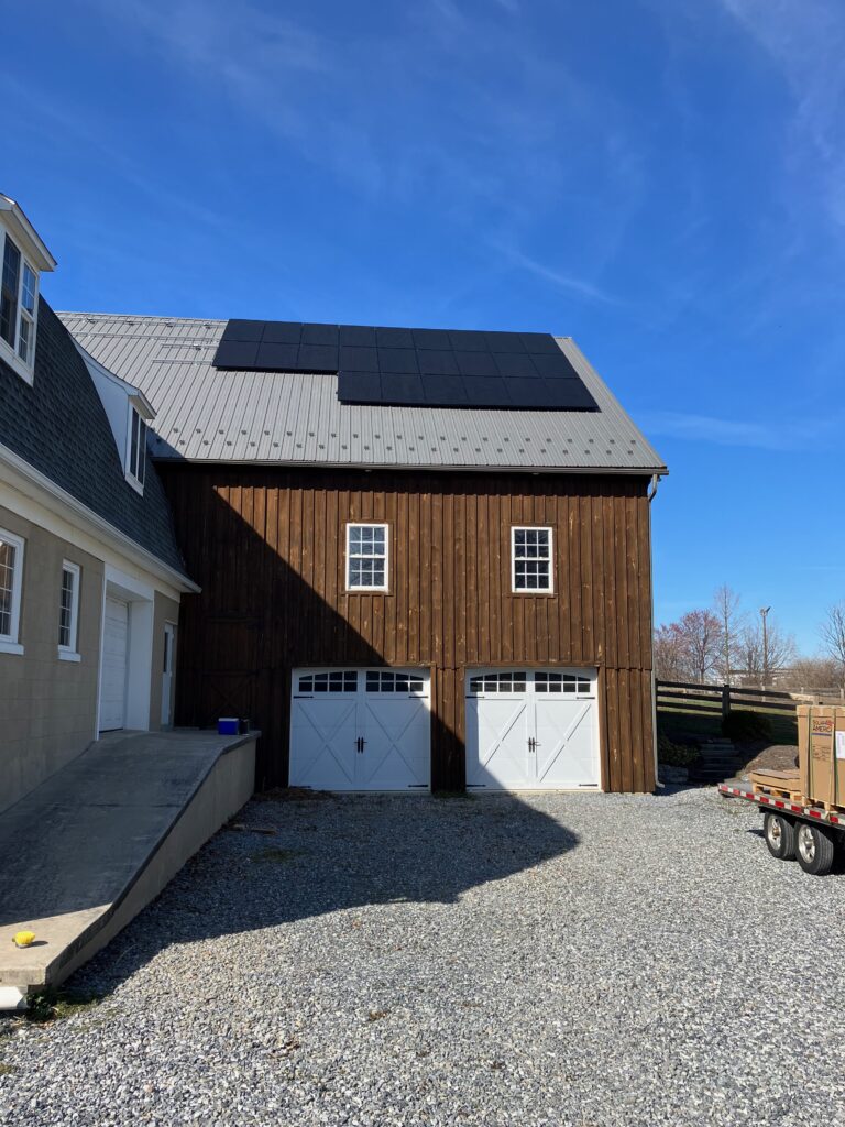 Panels being mounted on the Tough Trac panel mounting system being installed on a metal roof in mount joy pa